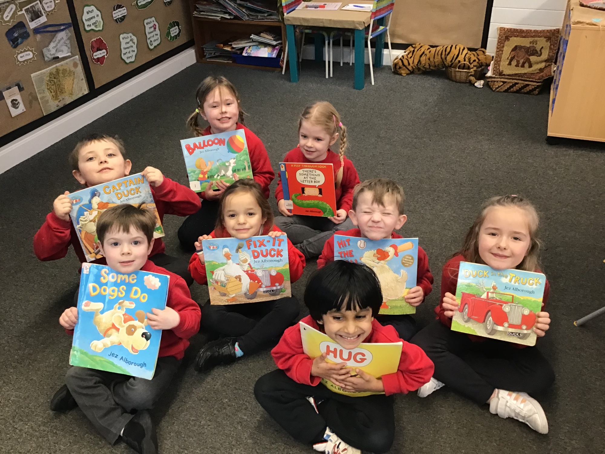children holding their favourite books